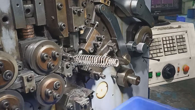 Barrel shaped compression spring