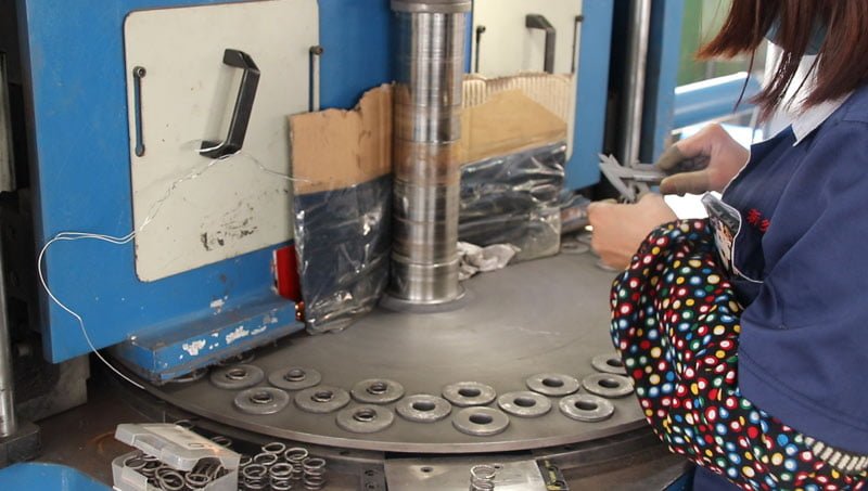 Compression spring end treatment