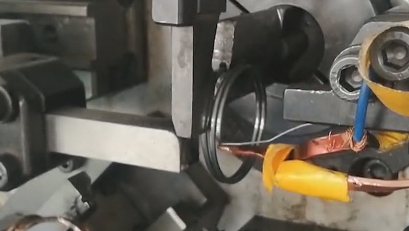 Flat wire torsion spring